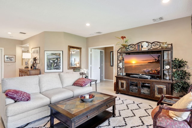 living room featuring visible vents and recessed lighting