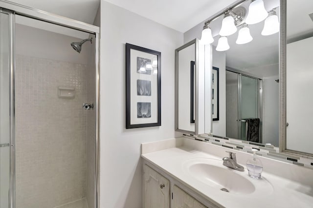 bathroom featuring a stall shower and vanity