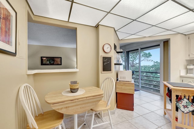 dining space featuring light tile patterned floors