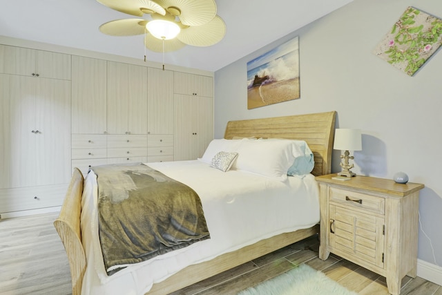 bedroom with ceiling fan and light wood finished floors