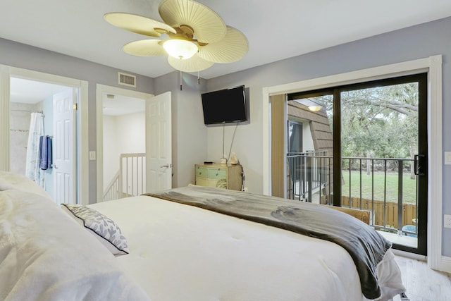 bedroom featuring access to exterior, visible vents, ceiling fan, and wood finished floors