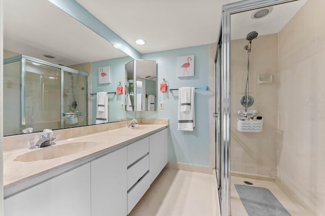 9965 NW 6th Ct, Plantation, FL 33324 - bathroom featuring double vanity, a stall shower, baseboards, tile patterned floors, and a sink