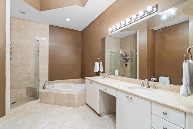 full bathroom with a garden tub, double vanity, a stall shower, and a sink