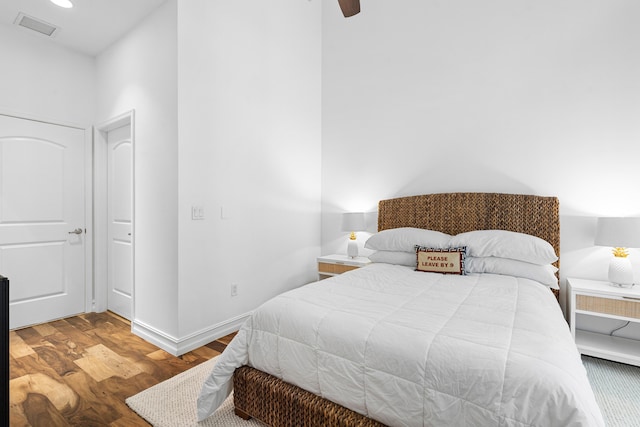 bedroom featuring recessed lighting, visible vents, a ceiling fan, wood finished floors, and baseboards