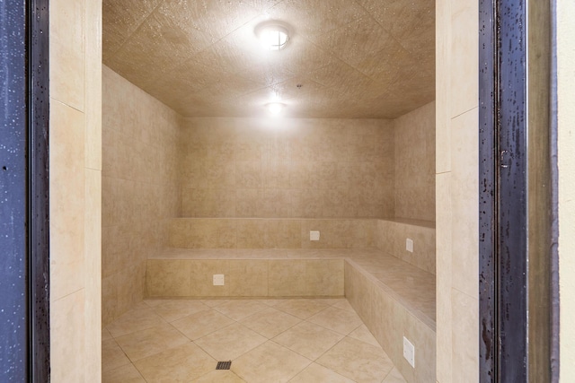 bathroom with tile patterned floors