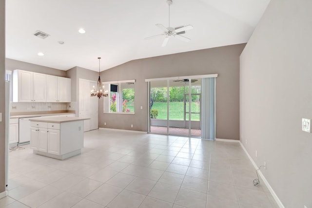 kitchen with ceiling fan with notable chandelier, light countertops, white dishwasher, and a healthy amount of sunlight