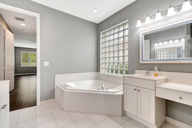 full bathroom featuring visible vents, tile patterned floors, vanity, a bath, and recessed lighting