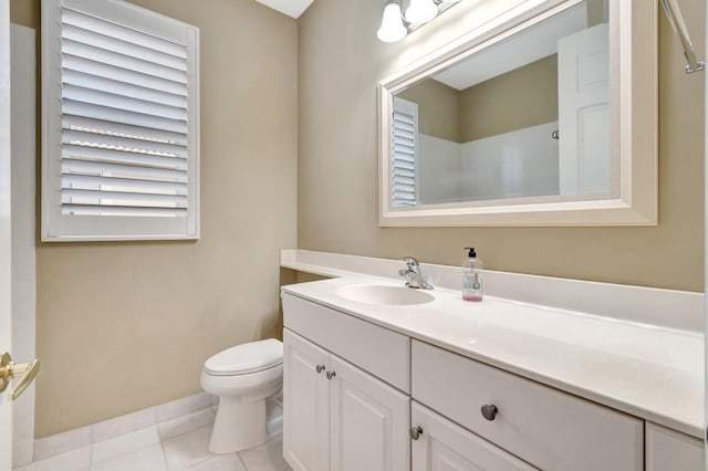 full bathroom featuring tile patterned flooring, vanity, and toilet