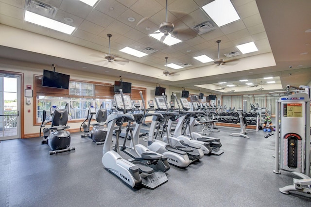 gym featuring a paneled ceiling, visible vents, and a ceiling fan