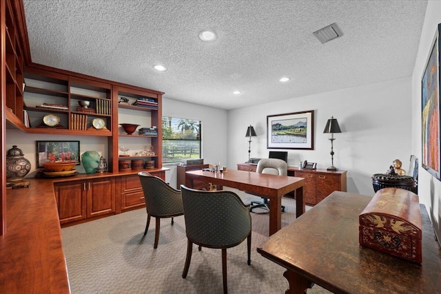 office area with recessed lighting, visible vents, and a textured ceiling