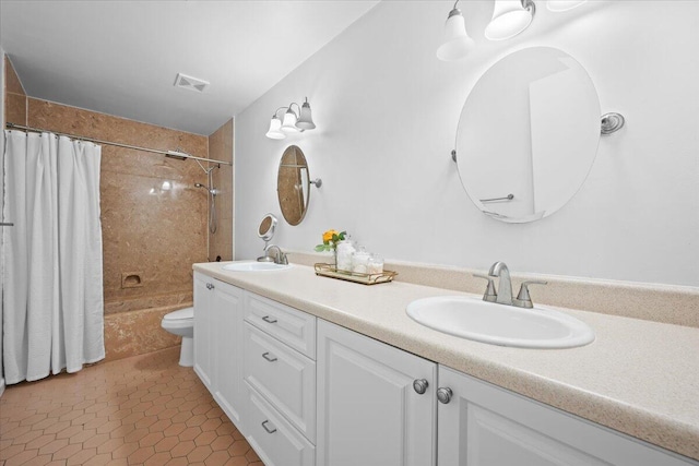 bathroom featuring double vanity, shower / bath combo, a sink, and visible vents