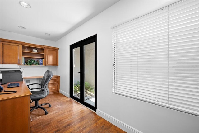 office space with recessed lighting, baseboards, wood finished floors, and french doors