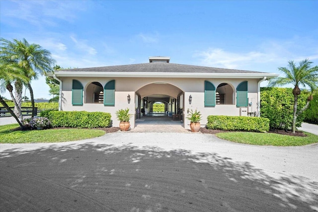 exterior space with driveway and stucco siding