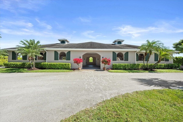 single story home featuring driveway and stucco siding