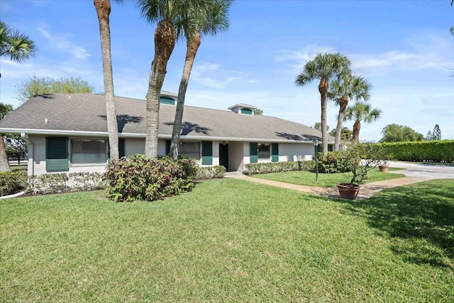 single story home with a front yard