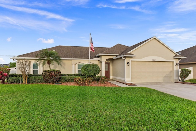 ranch-style house with a garage, concrete driveway, a front lawn, and stucco siding