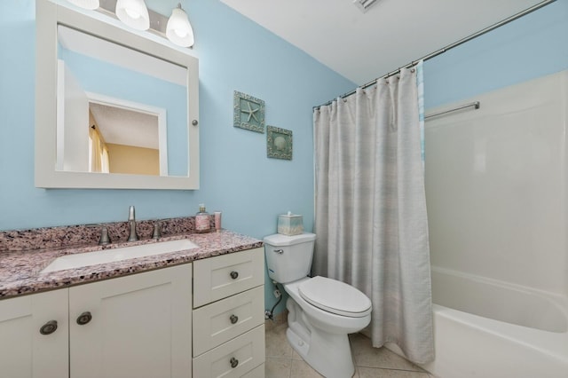 bathroom featuring shower / bath combo with shower curtain, vanity, toilet, and tile patterned floors