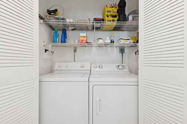 laundry area with laundry area and washer and clothes dryer