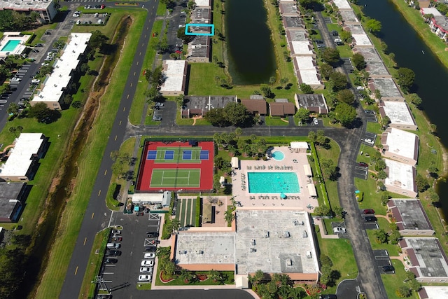 birds eye view of property with a water view