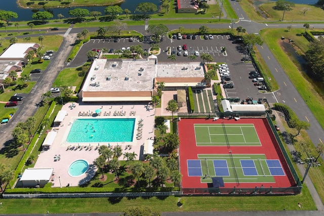 birds eye view of property with a water view