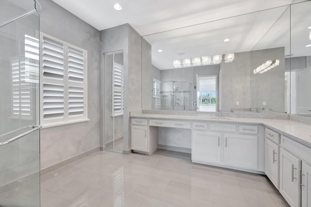 bathroom featuring a stall shower, recessed lighting, and vanity