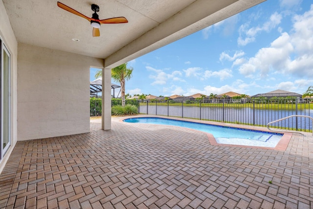 view of pool with a fenced in pool, a patio, a water view, a ceiling fan, and fence