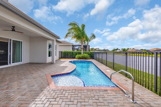 view of pool featuring a patio area, ceiling fan, a fenced in pool, and a fenced backyard