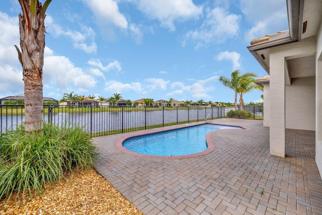 view of pool featuring a fenced in pool, a patio area, a water view, and a fenced backyard