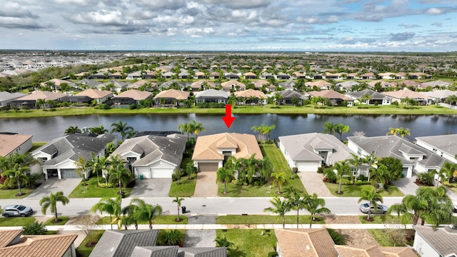 bird's eye view featuring a water view and a residential view