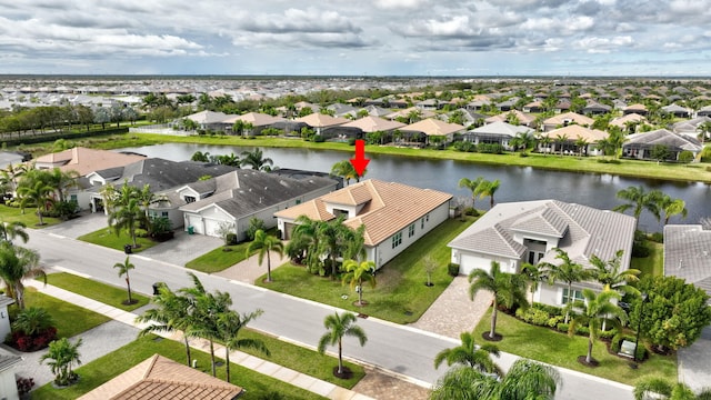 bird's eye view featuring a water view and a residential view