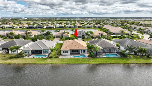 bird's eye view featuring a water view and a residential view