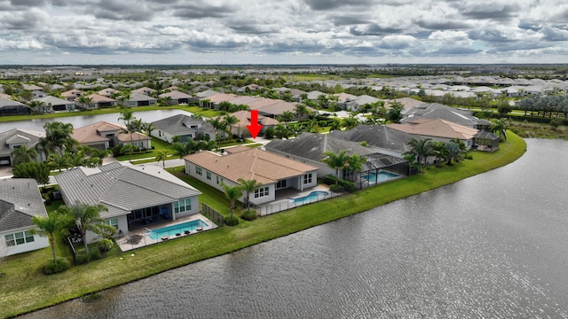 aerial view featuring a residential view and a water view