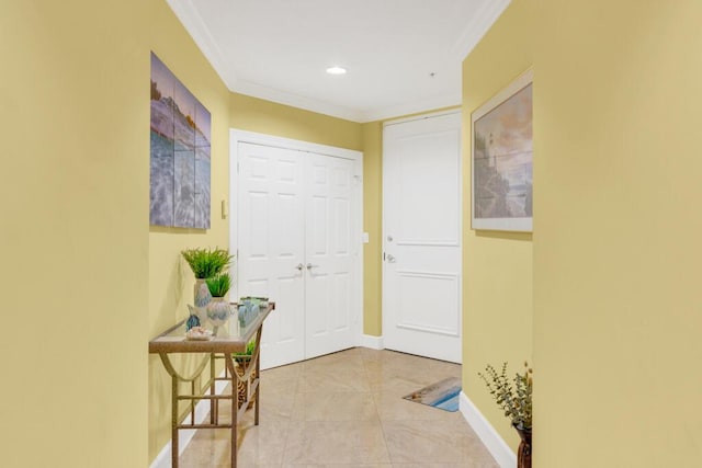 doorway to outside featuring ornamental molding, recessed lighting, tile patterned floors, and baseboards