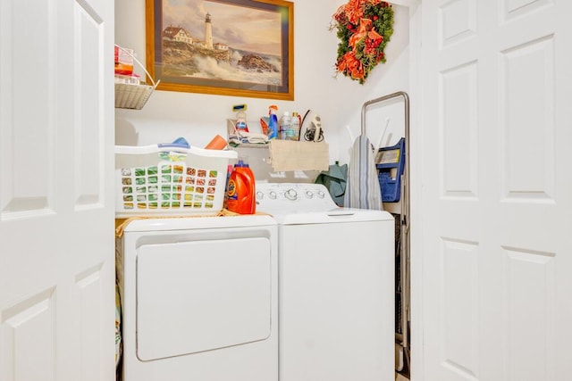 washroom featuring laundry area and washing machine and clothes dryer