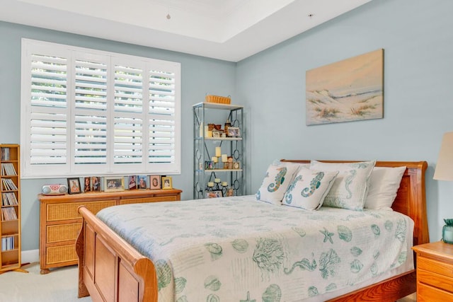 bedroom featuring light carpet