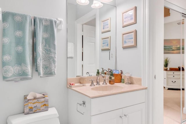 bathroom with vanity and toilet