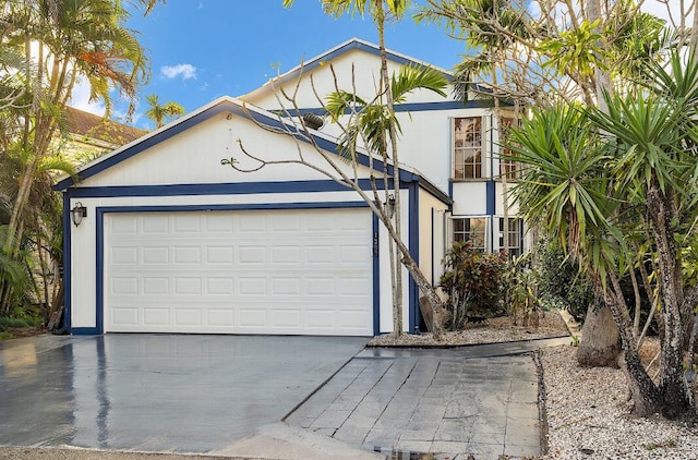 view of front facade with driveway and an attached garage