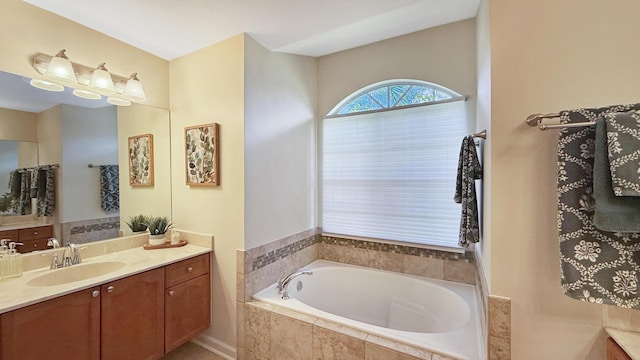 bathroom with vanity and a bath