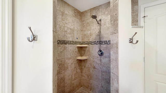 bathroom with a tile shower