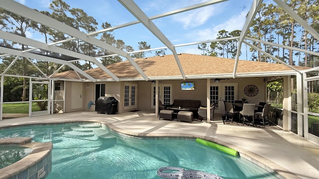 exterior space with stucco siding, a shingled roof, outdoor lounge area, and french doors