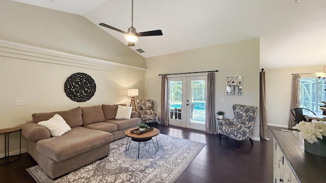 living room with a healthy amount of sunlight, visible vents, vaulted ceiling, and dark wood-style flooring