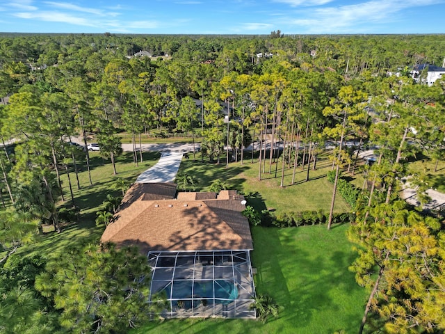 birds eye view of property with a wooded view