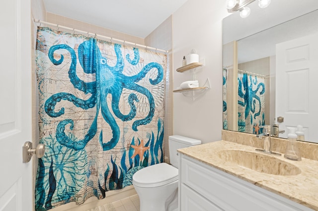 bathroom featuring toilet, curtained shower, and vanity