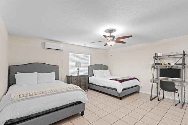 bedroom featuring ceiling fan, a textured ceiling, a wall unit AC, and light tile patterned flooring