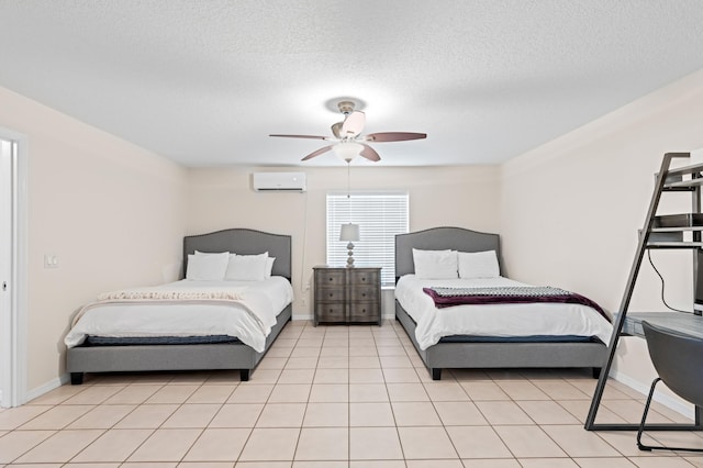 bedroom featuring a wall mounted air conditioner, ceiling fan, a textured ceiling, and light tile patterned flooring