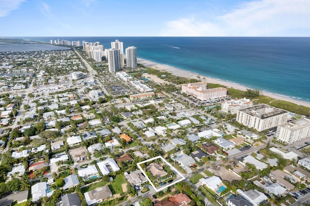 aerial view with a view of city, a water view, and a beach view