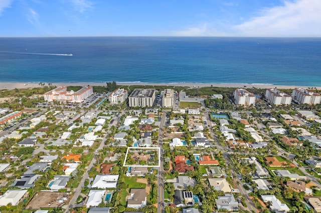 aerial view featuring a water view and a view of the beach