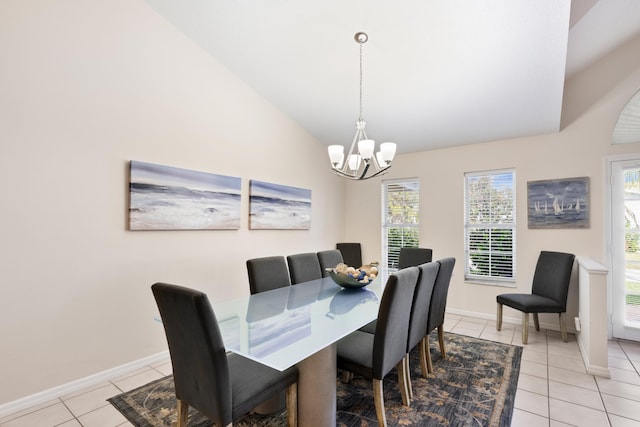 dining area featuring light tile patterned floors, vaulted ceiling, a chandelier, and baseboards