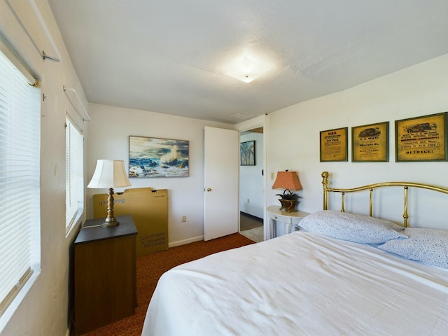 bedroom with dark carpet