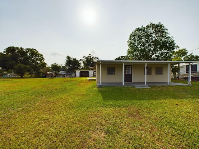 rear view of house with a lawn